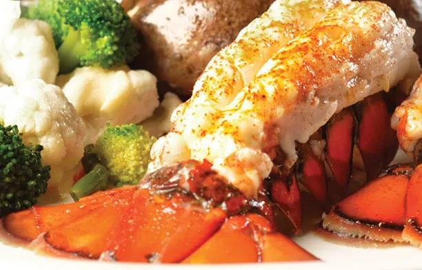 Broiled lobster tail with vegetables